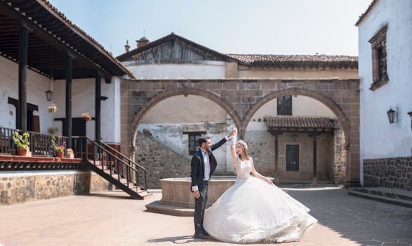 A bride and groom dance elegantly in a historic venue in Pátzcuaro, Mexico.